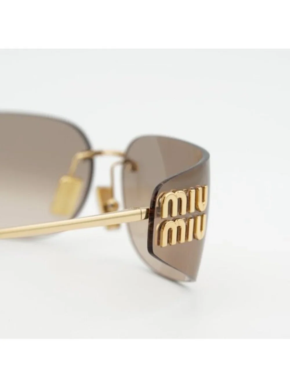 Miu Miu MUA51S 5AK20P Sunglasses Gold Rectangle Frame, Bronze Mirror Lenses